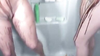 Horny chicks cover each other's naked bodies with paint in the shower - 11 image