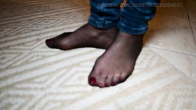Feet in black stockings and jeans - 6 image
