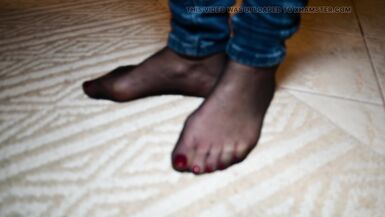 Feet in black stockings and jeans - 9 image