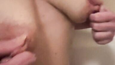 Mommy have a bath and play with her amazing tits and nipples.