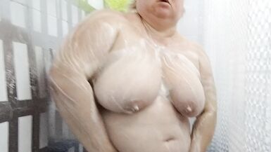 Naked stepmom with big tits and ass takes a shower - 12 image