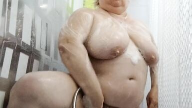 Naked stepmom with big tits and ass takes a shower - 14 image