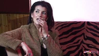 An elegant brunette MILF uses her holes to satisfy two very horny gentlemen - 1 image