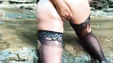 MILF Fists Herself on a Waterfall in Torn Stockings - 6 image