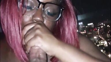 Sexy dark skinned girl sucks dick and takes cum in the face with a nice city view - 13 image