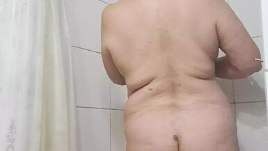 Wetting the body of a mature milf - 1 image