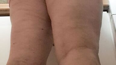 in the kitchen half-dressed