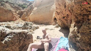 Blowjob with cumshot on a crowded beach... - 1 image