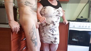 my mother-in-law saw my cock and began to milk it until I finished