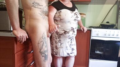 my mother-in-law saw my cock and began to milk it until I finished - 15 image