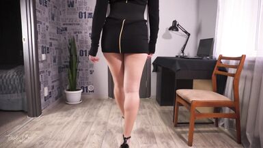 Sexy MILF in a bodysuit teasingly flaunts her long legs in high heels - 1 image