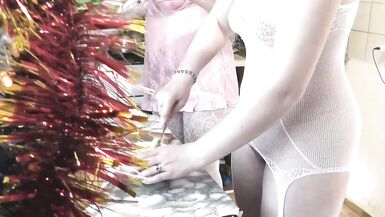 Konstanzia and her girlfriend kiss and eat each other's lips in the kitchen on New Year's Eve