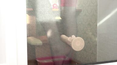 MILF neighbor caught fingering herself while playing with dildo by balcony door