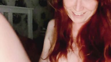 Lily Kink, a slim redhead, flaunts her wet pussy and tight ass in a steamy POV shower