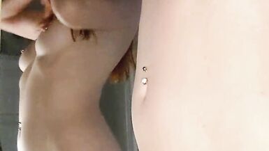 Lily Kink, a slim redhead, flaunts her wet pussy and tight ass in a steamy POV shower