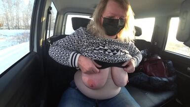 A Chubby MILF Rides in a Car and Shows Big Boobs, Hairy Pussy on a Webcam. - 1 image