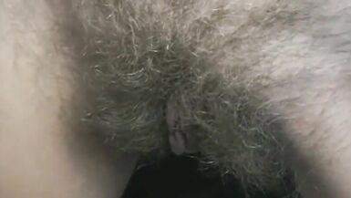 Showing hairy pussy in front of cam standing up