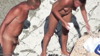 Nudists fuck a friend on the beach - 2 image