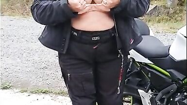 Milf flashing tits outdoor and do a hand job on hers hubby. - 2 image