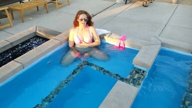 Sexy Nymph in Pink Bikini Plays in the Pool