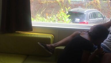 Wife giving risky blowjob in front of window in a camping - 1 image
