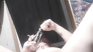 Pierced Kitty Smokes and Fucks a Bottle