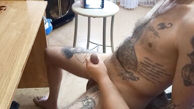 I'm sitting in a chair and my dick is being jerked off